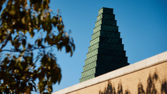 The Saïd Business School tower on a sunny day. 