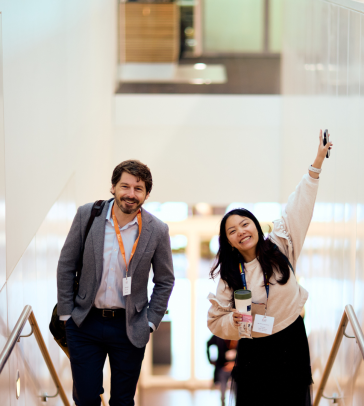 Hudson Baird and Diana Chao walking up the SBS staircase. 