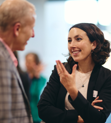 Jessica Jacobson speaking to someone at the Nestle event. 