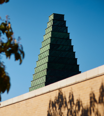 The Oxford SBS Ziggurat tower against a blue sky. 