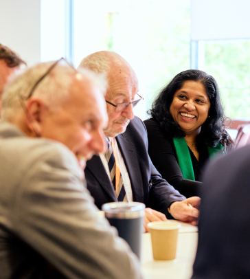 Esther Benjamin chatting with people at the Skoll Community Convening.