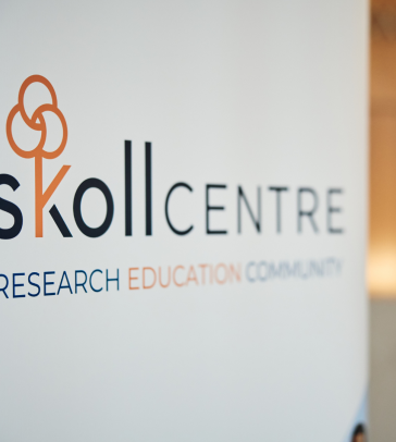 A picture of a Skoll Centre sign, which reads 'Research, Education, Community.