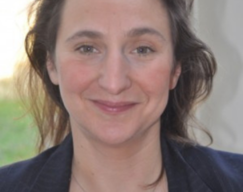 Anna Griffiths smiling in a black blazer.