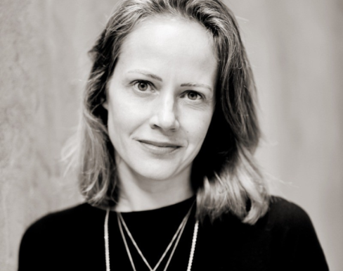 Claire Diaz Ortiz wearing a black jumper and leaning against a wall.