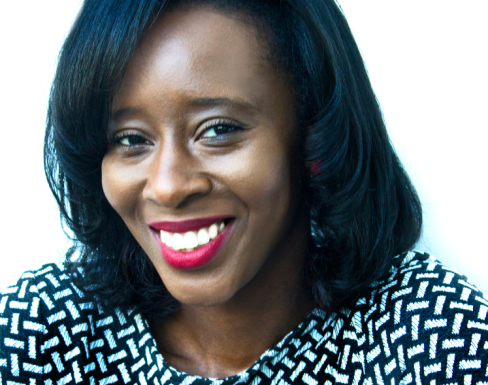 Deborah Owhin wearing a polka dot top and smiling. 