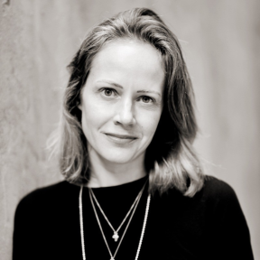 Claire Diaz Ortiz wearing a black jumper and leaning against a wall.
