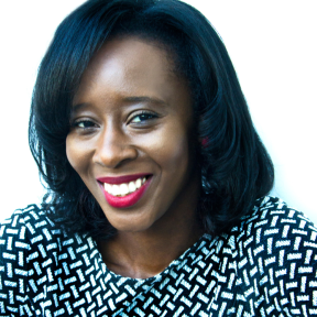 Deborah Owhin wearing a polka dot top and smiling. 