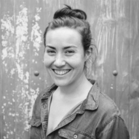 Julie Greene smiling and wearing a shirt.