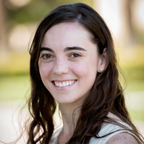 Macarena Hernandez de Obeso smiling and wearing a white shirt.