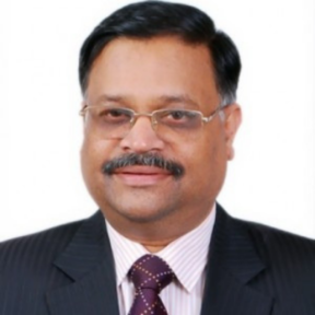 Sitaramachandra Machiraju standing against a white background wearing a suit and tie.